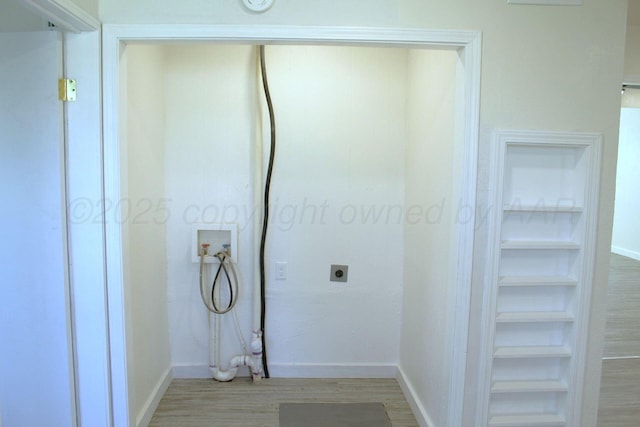 1306 N Lake St, Amarillo, TX 79107 - laundry area featuring washer hookup, electric dryer hookup, light wood-type flooring, and baseboards
