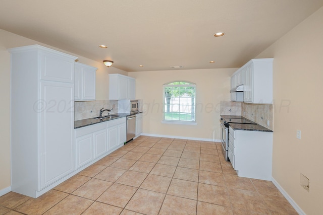 8403 Irvington Ct, Amarillo, TX 79119 - kitchen featuring stainless steel appliances, decorative backsplash, white cabinetry, a sink, and recessed lighting