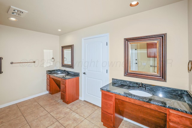 8403 Irvington Ct, Amarillo, TX 79119 - bathroom with baseboards, two vanities, tile patterned flooring, and recessed lighting