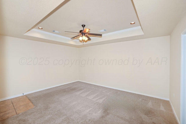 8403 Irvington Ct, Amarillo, TX 79119 - spare room featuring a raised ceiling, ceiling fan, carpet, recessed lighting, and baseboards