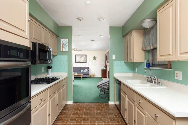 2819 Lloyd Dr, Amarillo, TX 79110 - kitchen with appliances with stainless steel finishes, a sink, light countertops, and a warming drawer