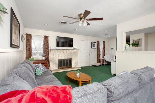 2819 Lloyd Dr, Amarillo, TX 79110 - carpeted living room with a wainscoted wall, ceiling fan, and a fireplace