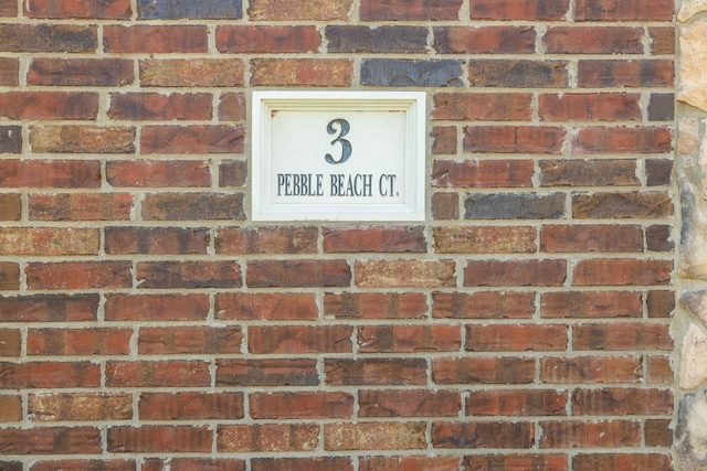 exterior details featuring brick siding