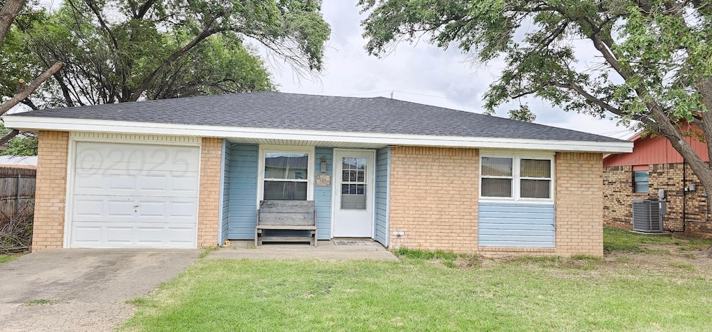1601 E 8th St, Dalhart, TX 79022 - ranch-style house featuring brick siding, asphalt driveway, a front lawn, a garage, and roof with shingles