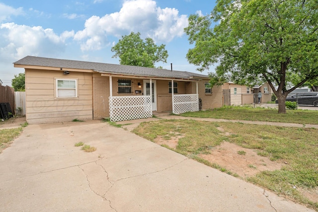 3515 NE 19th Ave, Amarillo, TX 79107 - view of front of home with covered porch, brick siding, and driveway