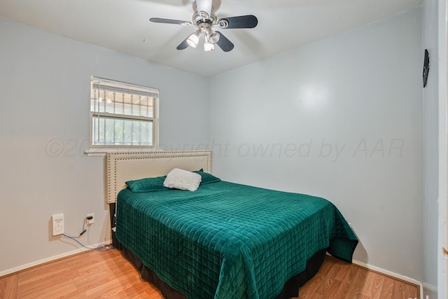 3515 NE 19th Ave, Amarillo, TX 79107 - bedroom with wood finished floors, baseboards, and ceiling fan