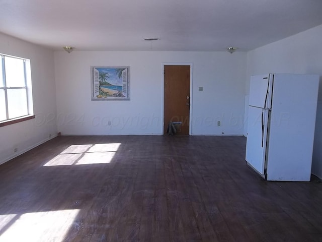 empty room featuring dark wood-type flooring