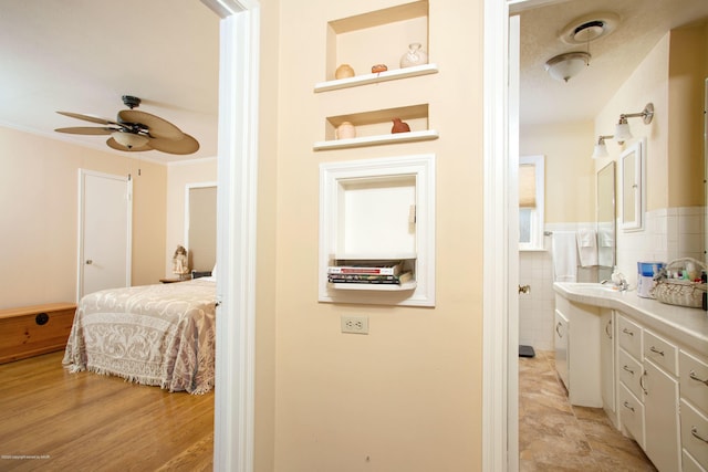 1219 S Rusk St, Amarillo, TX 79102 - hallway featuring tile walls and crown molding