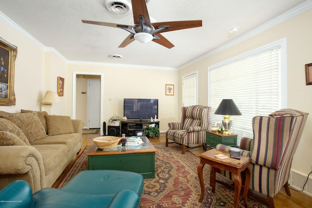 1219 S Rusk St, Amarillo, TX 79102 - living area with ornamental molding, wood finished floors, plenty of natural light, and a ceiling fan