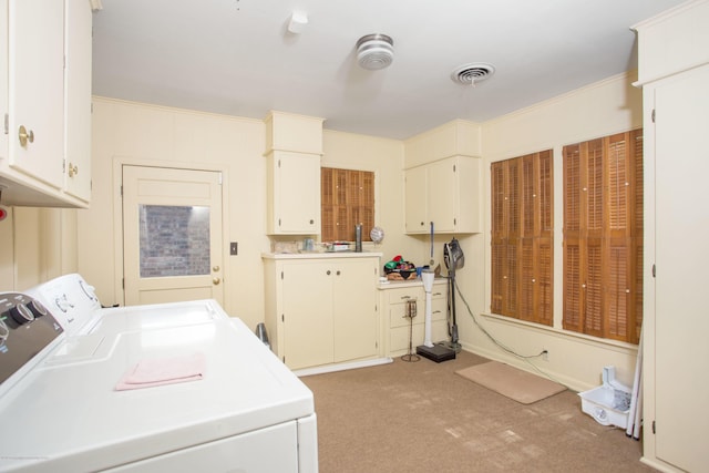 1219 S Rusk St, Amarillo, TX 79102 - laundry area with washing machine and dryer, light colored carpet, and cabinet space