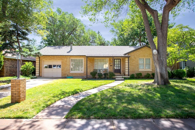 1219 S Rusk St, Amarillo, TX 79102 - single story home with a garage, a front lawn, concrete driveway, and brick siding