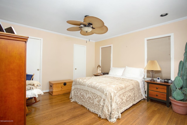 1219 S Rusk St, Amarillo, TX 79102 - bedroom with wood finished floors, ornamental molding, and ceiling fan