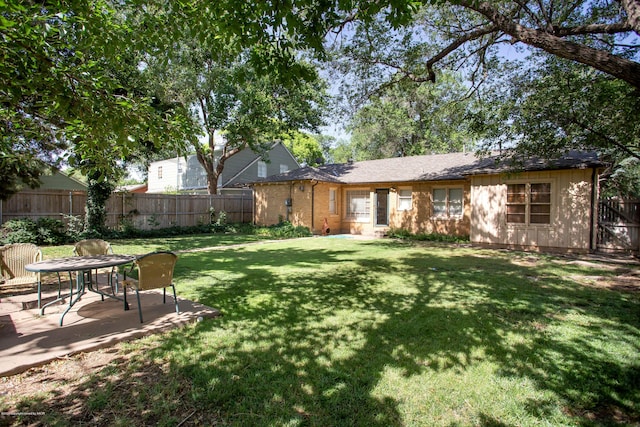 1219 S Rusk St, Amarillo, TX 79102 - fenced backyard with a patio