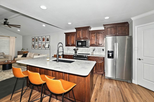 5001 Gloster St, Amarillo, TX 79118 - kitchen featuring stainless steel refrigerator with ice dispenser, a sink, ceiling fan, light wood finished floors, and black electric range