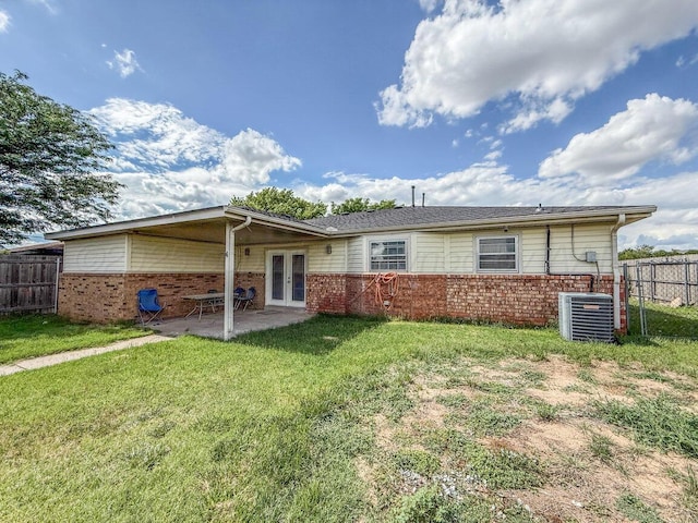 5101 Pin Oak Dr, Amarillo, TX 79110 - back of house with french doors, brick siding, and a patio area