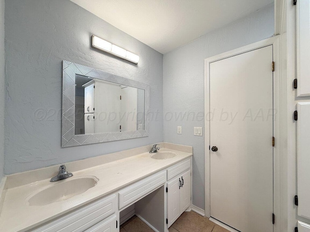 5101 Pin Oak Dr, Amarillo, TX 79110 - full bath with double vanity, a textured wall, and tile patterned flooring