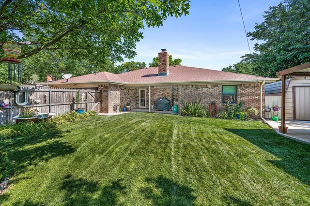 4012 Linda Dr, Amarillo, TX 79109 - rear view of house featuring brick siding, a shed, a chimney, and a shingled roof