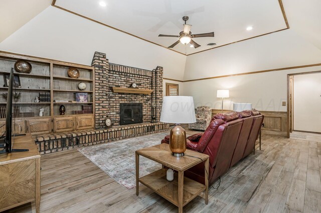 4012 Linda Dr, Amarillo, TX 79109 - living area with ceiling fan, light wood-style floors, a brick fireplace, a wainscoted wall, and recessed lighting