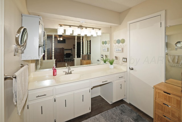 7303 Jameson Dr, Amarillo, TX 79121 - bathroom featuring vanity, wood finished floors, and a ceiling fan