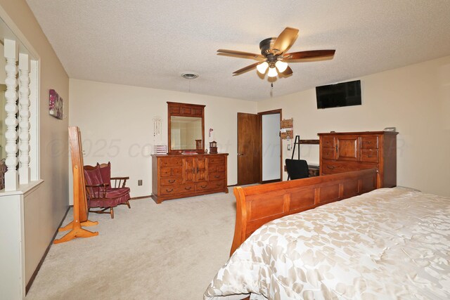 7303 Jameson Dr, Amarillo, TX 79121 - bedroom with light carpet, a textured ceiling, and a ceiling fan