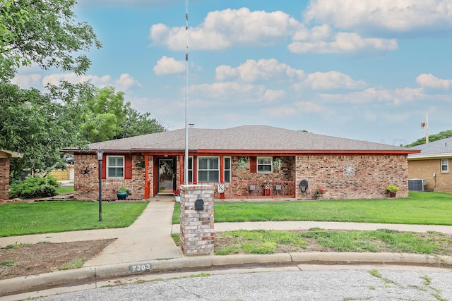 7303 Jameson Dr, Amarillo, TX 79121 - ranch-style home featuring a front lawn, brick siding, and a shingled roof