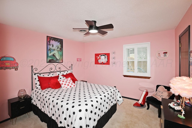 7303 Jameson Dr, Amarillo, TX 79121 - bedroom featuring light colored carpet, ceiling fan, and a textured ceiling