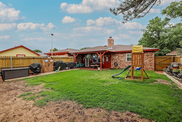 7303 Jameson Dr, Amarillo, TX 79121 - rear view of property featuring a fenced backyard, a patio, a chimney, and brick siding