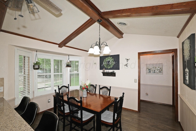 7303 Jameson Dr, Amarillo, TX 79121 - dining area featuring dark wood finished floors, wainscoting, and a chandelier