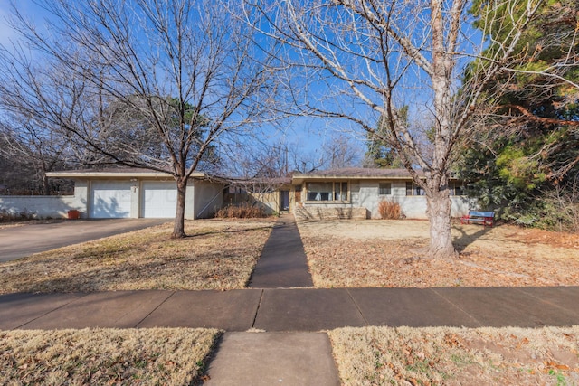 ranch-style home with a garage