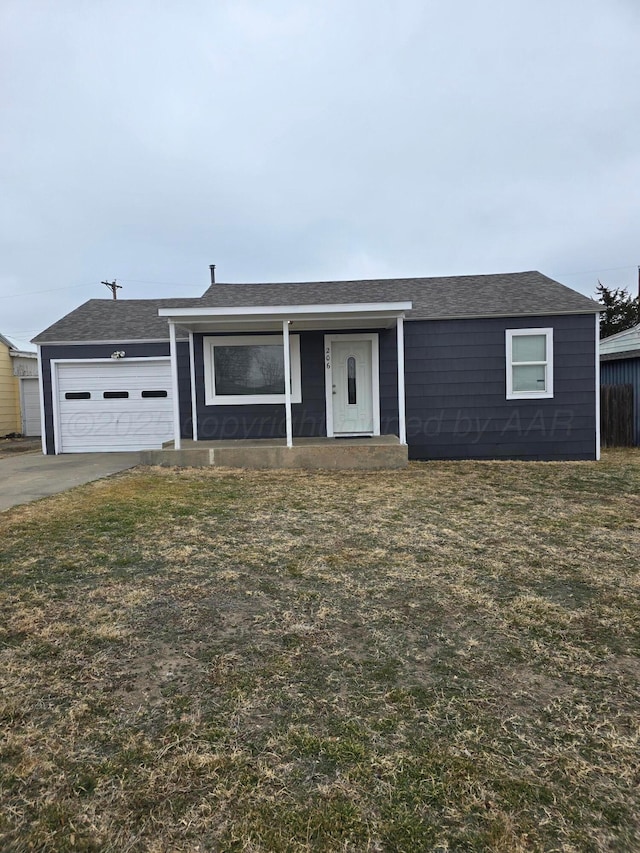 ranch-style home with a garage and a front yard