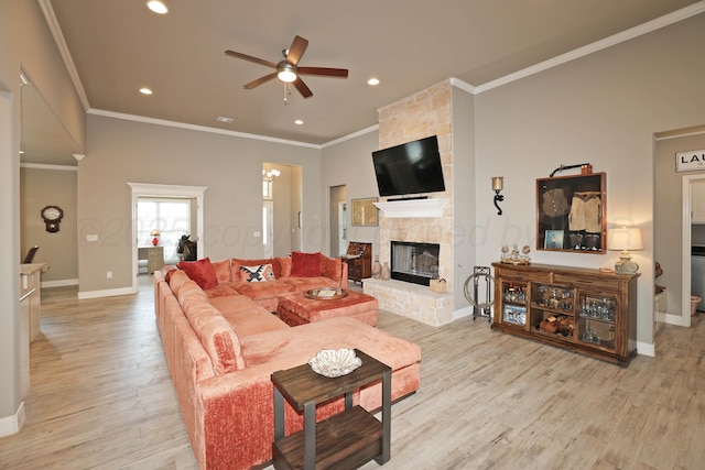 6702 Tatum Cir, Amarillo, TX 79119 - living area featuring ceiling fan, ornamental molding, light wood finished floors, a large fireplace, and recessed lighting
