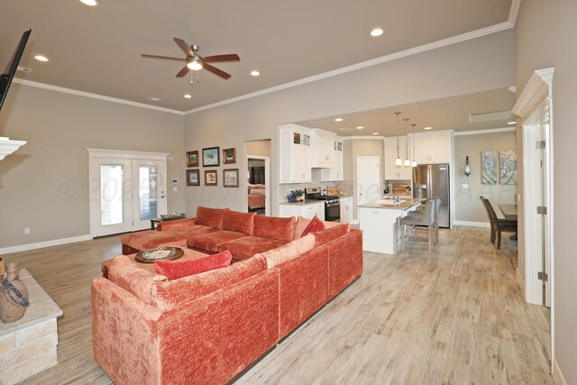 6702 Tatum Cir, Amarillo, TX 79119 - living room with ceiling fan, light wood-type flooring, recessed lighting, and crown molding