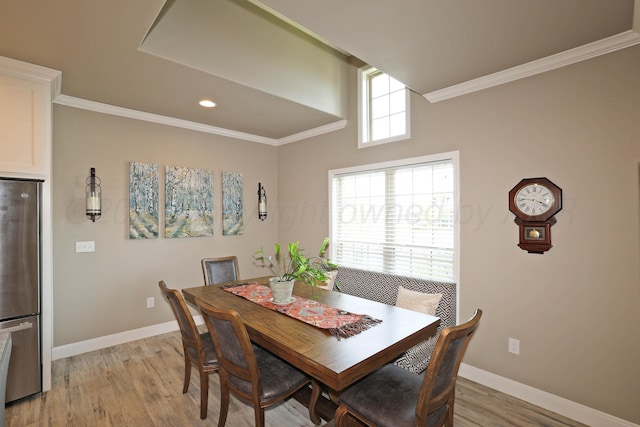 6702 Tatum Cir, Amarillo, TX 79119 - dining space featuring light wood finished floors, ornamental molding, and recessed lighting