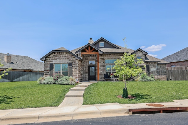 6702 Tatum Cir, Amarillo, TX 79119 - craftsman-style home with brick siding, a chimney, and a shingled roof