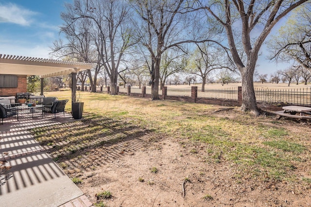 view of yard featuring a pergola, an outdoor hangout area, and a patio area