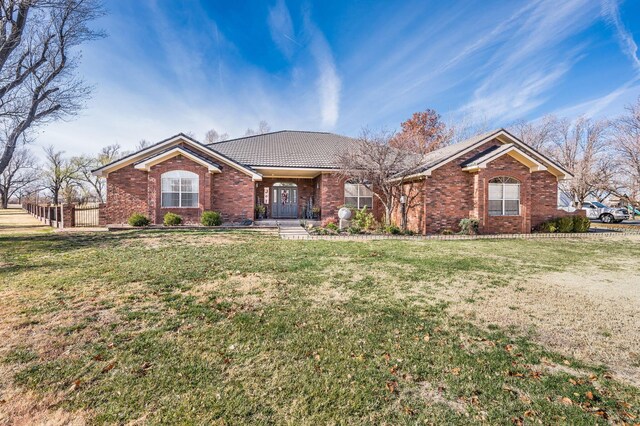 ranch-style house with a front lawn