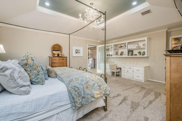 carpeted bedroom featuring a raised ceiling, crown molding, and a chandelier