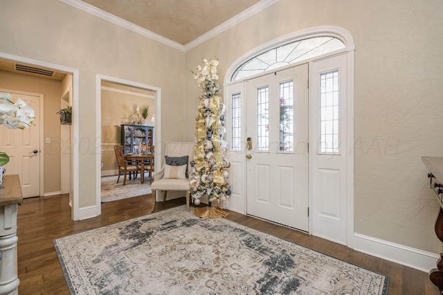 entryway featuring dark wood-type flooring and ornamental molding