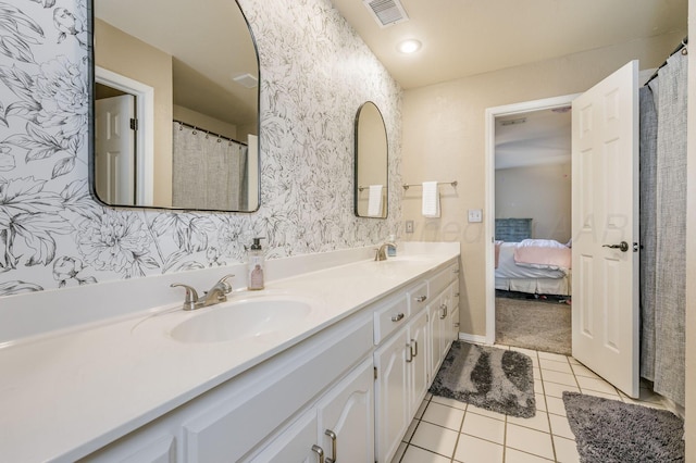 bathroom with tile patterned flooring and vanity