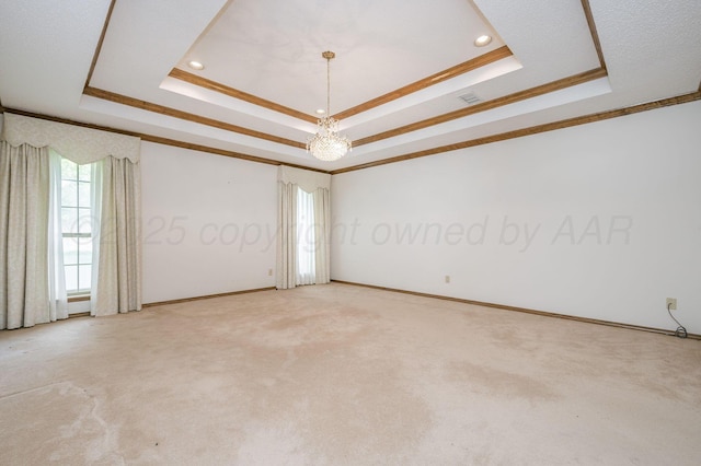 3457 Colchester Pl, Amarillo, TX 79121 - spare room with an inviting chandelier, a raised ceiling, ornamental molding, and light colored carpet