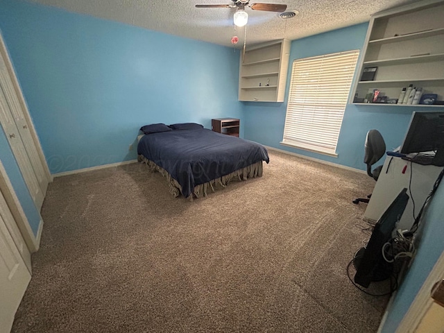 7906 Merchant Dr, Amarillo, TX 79121 - carpeted bedroom featuring baseboards, a ceiling fan, and a textured ceiling