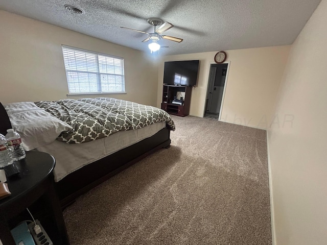 7906 Merchant Dr, Amarillo, TX 79121 - bedroom featuring visible vents, carpet floors, a textured ceiling, and ceiling fan
