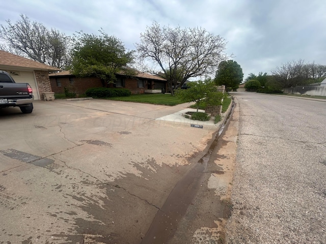 7906 Merchant Dr, Amarillo, TX 79121 - view of road featuring curbs