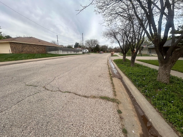 7906 Merchant Dr, Amarillo, TX 79121 - view of road with curbs and sidewalks