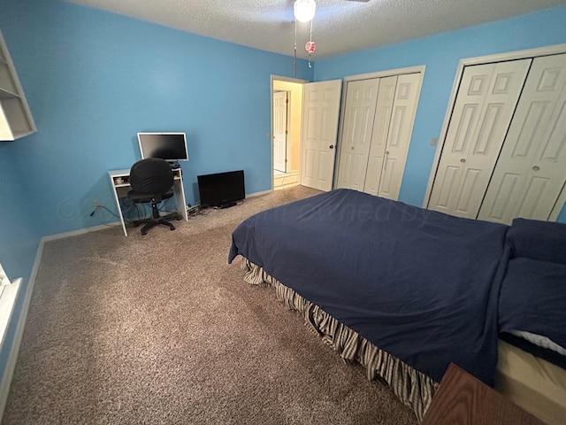 7906 Merchant Dr, Amarillo, TX 79121 - carpeted bedroom featuring a textured ceiling, multiple closets, and baseboards