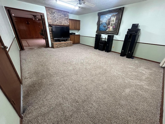 7906 Merchant Dr, Amarillo, TX 79121 - unfurnished living room featuring a textured ceiling, light carpet, baseboards, and ceiling fan