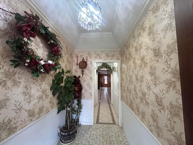 7906 Merchant Dr, Amarillo, TX 79121 - corridor featuring light tile patterned flooring, a textured ceiling, crown molding, and a wainscoted wall