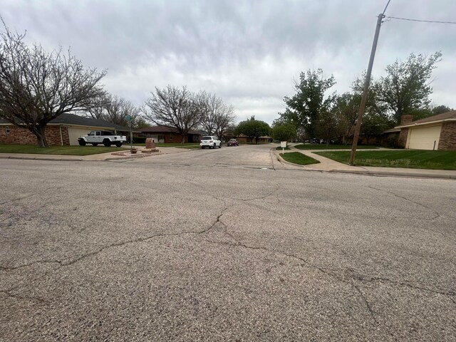 7906 Merchant Dr, Amarillo, TX 79121 - view of road with curbs and sidewalks