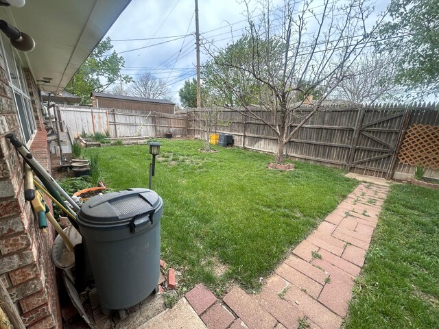 7906 Merchant Dr, Amarillo, TX 79121 - view of yard featuring a fenced backyard