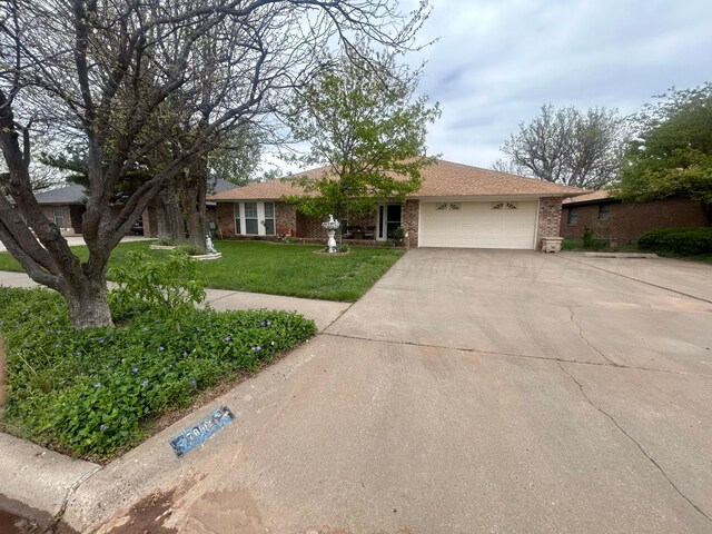 7906 Merchant Dr, Amarillo, TX 79121 - ranch-style house featuring concrete driveway, brick siding, a front yard, and a garage